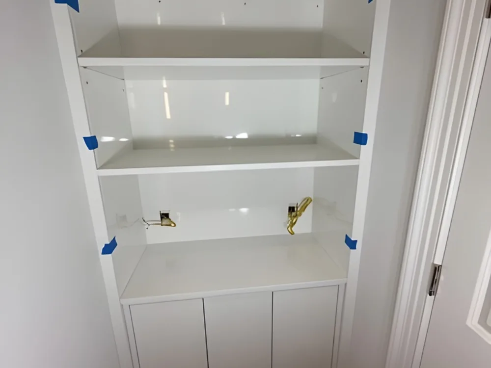 Custom built-in cabinet installation with upper shelving