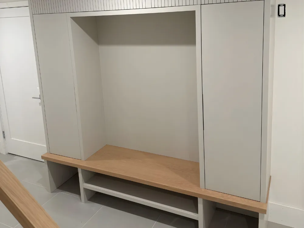 Custom mudroom built-in with bench and open storage