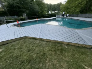 Custom pool deck reconstruction with newly installed patterned boards