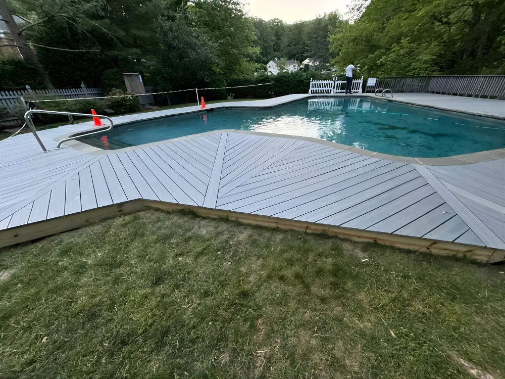 Custom pool deck reconstruction with newly installed patterned boards